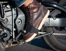 Close-up of black leather motorcycle shifter boot protector, riding