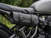 Personalized black leather motorcycle tool bag securely mounted on a motorcycle, featuring custom name engraving and durable storage for essential motorcycle repair tools and riding gear