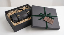 Personalized black leather motorcycle tool roll in a premium gift box with custom name engraving, handcrafted tool organizer and elegant gift packaging for motorcycle enthusiasts.