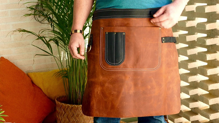 Handmade leather apron in use by a professional chef, bartender, or barista, showcasing its functionality and stylish design. Perfect for restaurants, cafes, or workshops, this custom leather apron is made from high-quality, durable leather for daily work.
