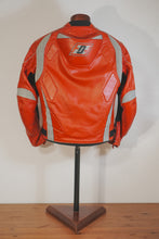 Back view of red leather motorcycle jacket by Fashion Racing on mannequin – showing padded design and reflective gray details.