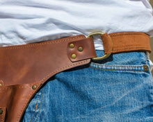 Brown leather floral tool belt with brass rivets
